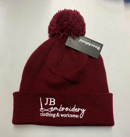 Logo embroidered on pompom company hat