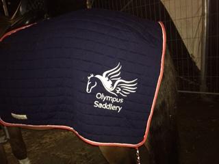 Olympus saddlery embroidered on horse rug